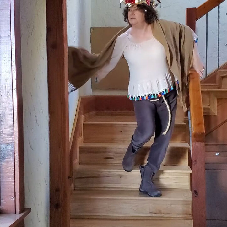 Nicole dancing down the stairs in costume