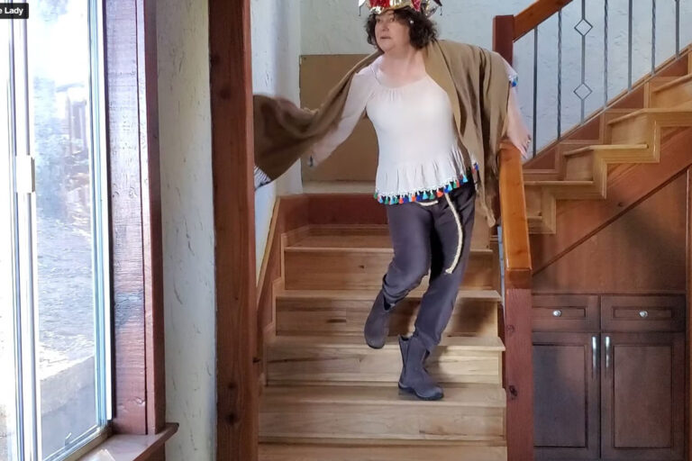 Nicole dancing down the stairs in costume