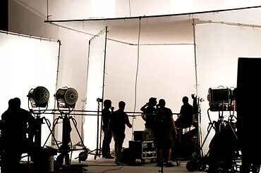 a soundstage with people in silhouette